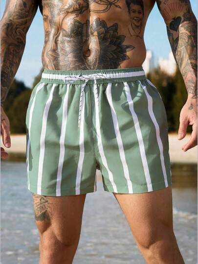 Manfinity Swimmode شورت شاطئ مقلم مع خصر بسحاب وجيوب مائلة ، شورت صيفي أسلوب العطلات للرجال، أسلوب هاواي