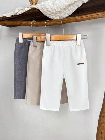 3 قطع/عبوة بنطال قصير للأولاد الرضع مرن الخصر، يتضمن 3 بناطيل نسيجية باللون الأبيض والخردل والرمادي داكن، مع رقع جلدية بني اللون على الأمام، مناسب للربيع/الصيف، للرياضة الخارجية والاستعمال اليومي، للأولاد من 6 أشهر إلى 2-3 سنوات