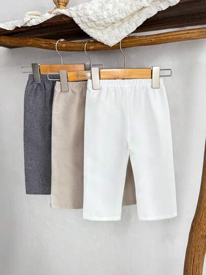 3 قطع/عبوة بنطال قصير للأولاد الرضع مرن الخصر، يتضمن 3 بناطيل نسيجية باللون الأبيض والخردل والرمادي داكن، مع رقع جلدية بني اللون على الأمام، مناسب للربيع/الصيف، للرياضة الخارجية والاستعمال اليومي، للأولاد من 6 أشهر إلى 2-3 سنوات