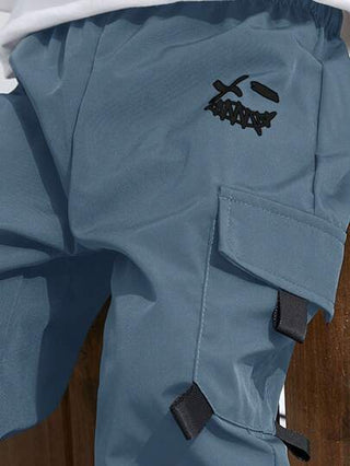 SHEIN بنطلون فضفاض ناعم للأولاد المراهقين مزين برسومات، جيوب ، مناسب للتنقل والمدرسة والأنشطة اليومية والسفر والرياضة في الربيع والصيف والخريف والشتاء