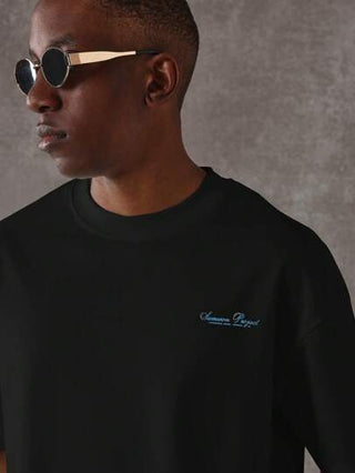 SUMWON تي شيرت كبير الحجم قطع الراحة الكلاسيكية شعار كم قصير ملابس الشارع الفاخرة قياس منتظم أساسي مبسط مجموعة الربيع والصيف