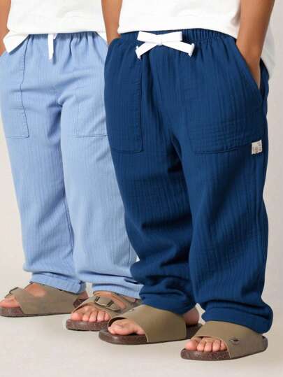 SHEIN مجموعة 2 قطعة من البنطلونات اليومية المريحة ذات الجيوب للأطفال الرضع والصغار، متعددة الاستخدامات لارتداءها في الأماكن المغلقة والخارجية والرياضة واللعب والحفلات والتصوير والعطلات، مناسبة للربيع والصيف