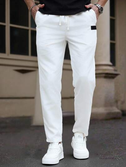 Manfinity Homme بنطال رجالي ساق مستقيمة، بخصر مطاطي وسحاب، مزين بتفاصيل حافة الكاحل