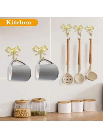 هوك الحائط الذهبي بشكل فيونكة، هوك الفيونكة الذهبي، هوك الحائط من النحاس الأصفر بشكل فيونكة، علّاق الباب، هوك المنشفة، هوك معطف من النحاس الأصفر، هوك زخرفي للزفاف والحمام وغرفة المعيشة والمطبخ، علّاق معدني من النحاس الأصفر مركب على الحائط لغرفة...