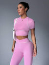 SHEIN Sport Studio بذلة رياضية مكونة من ملابس علوية ذات رقبة مستديرة وأكمام قصيرة مع لون متباين للتريم وبنطلون ذو ساق واسعة طويلة