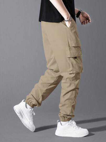 Manfinity Homme البنطلونات الرياضية السفلية الرجالية ذات اللون الواحد والجيب الكبير