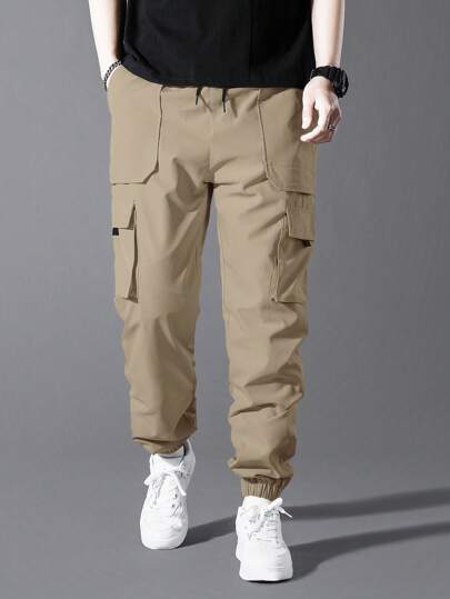 Manfinity Homme البنطلونات الرياضية السفلية الرجالية ذات اللون الواحد والجيب الكبير