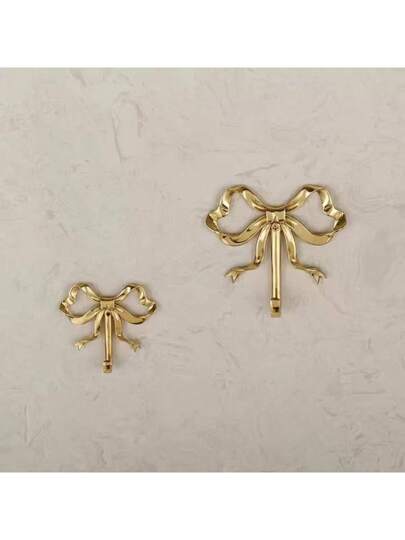 هوك حائط على شكل فيونكه ذهبي، هوك على شكل فيونكة ذهبي، هوك حائط على شكل فيونكة من النحاس الأصفر، شماعة للباب، هوك مناشف، هوك معطف من النحاس الأصفر، هوك ديكوري للزفاف والحمام وغرفة المعيشة والمطبخ، شماعة حائطية من المعدن النحاسي المطلي للمعيشة...