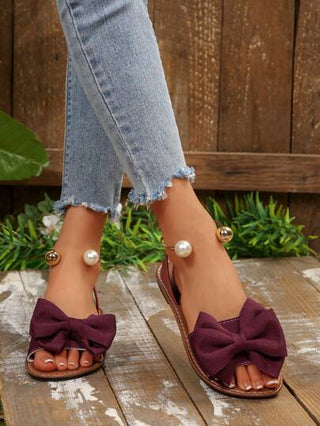 حذاء شبشب نسائي مريح بمقاسات كبيرة، بطراز بسيط وأنيق برؤوس مدورة مزين بفيونكة وخرزات معدنية، شبشب كاجوال للصيف للشاطئ وللاستخدام اليومي