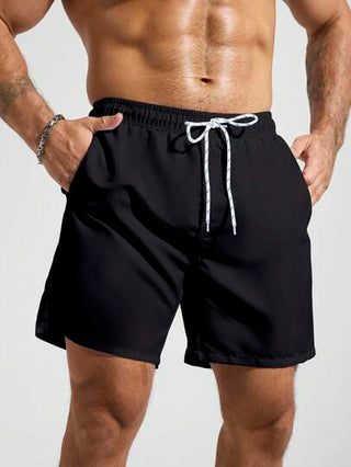 Manfinity Swimmode شورت شاطئ ذو لون سادة مع جيب وخصر جذب، مناسب للصيف