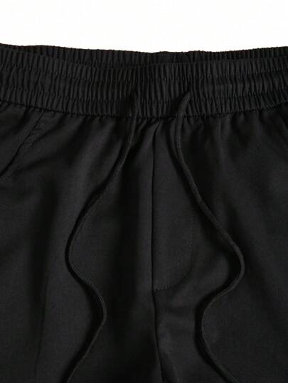 Manfinity Homme بنطلون رجالي بخصر ربطة بجيوب كارجو ذو لون أحادي كاجوال