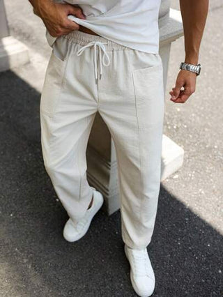 Manfinity Homme بناطيل كاجوال للرجال ذات لون أحادي مع خصر سحاب و جيوب، ضيقة في أسفل الساق