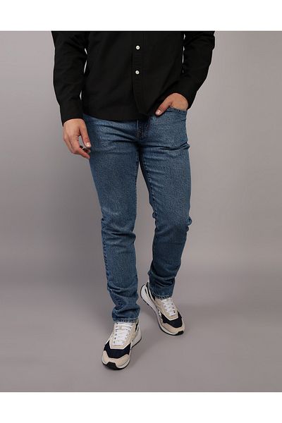 جينز AE EasyFlex بقصة ضيقة - U-0117-6823 American Eagle