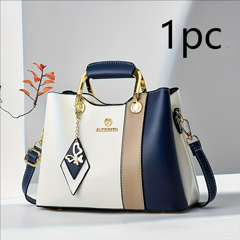 حقيبة يد نسائية عصرية بتصميم لونين متباينين - الأزرق الداكن، الأبيض والبيج، مع أجزاء ذهبية، حزام كتف قابل للتعديل، مناسبة للاستخدام اليومي ومحتويات محفظة من قطعة واحدة إلى أربع قطع