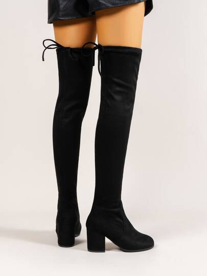 بوت بوت مرتفعة مقدمة مطوية من الجلد الأحمر الداكن لتناسب الفساتين السوداء والمعاطف والسترات الصوفيةرمضان