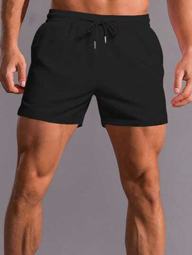 Manfinity Homme سروال شورت أسود سادة فضفاض للرجال مع حبل فيخصر بخصائص عملية لممارسة الرياضة والاستخدام اليومي، هدية للزوج أو الخطيب