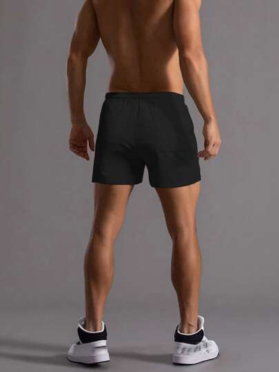 Manfinity Homme سروال شورت أسود سادة فضفاض للرجال مع حبل فيخصر بخصائص عملية لممارسة الرياضة والاستخدام اليومي، هدية للزوج أو الخطيب