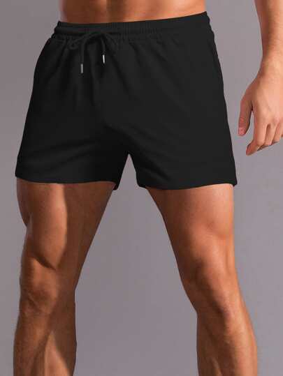 Manfinity Homme سروال شورت أسود سادة فضفاض للرجال مع حبل فيخصر بخصائص عملية لممارسة الرياضة والاستخدام اليومي، هدية للزوج أو الخطيب