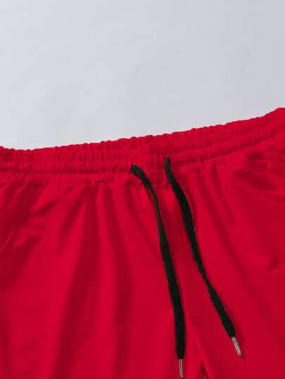 Manfinity Sporsity شورت بسحاب للرجال بطباعة حرفية على الخصر للكرة الطائرة