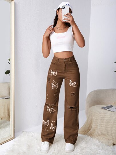 SHEIN EZwear بنطلون جينز باهت اللون بتفاصيل ممزق فراشة