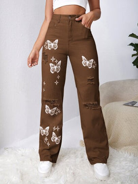 SHEIN EZwear بنطلون جينز باهت اللون بتفاصيل ممزق فراشة