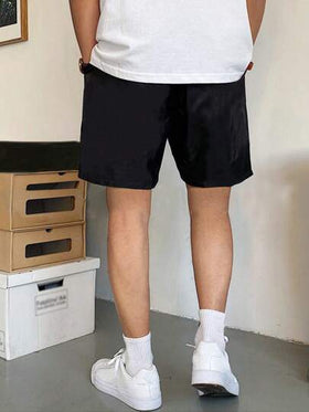 Manfinity Homme شورت رجالي فضفاض الخصر مع جيوب مائلة