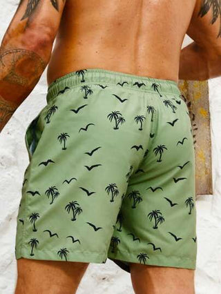 Manfinity Swimmode شورتات سباحة مع خصر رباط مطبوع عليها أشجار جوز الهند والطيور بنمط هاواي للرجال