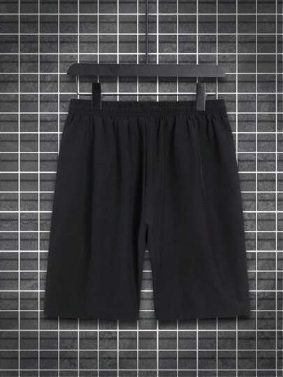 Manfinity Homme شورت رجالي بحزام مع رسومات طبعة الحيوانات ورسومات جرافيكية الحجم