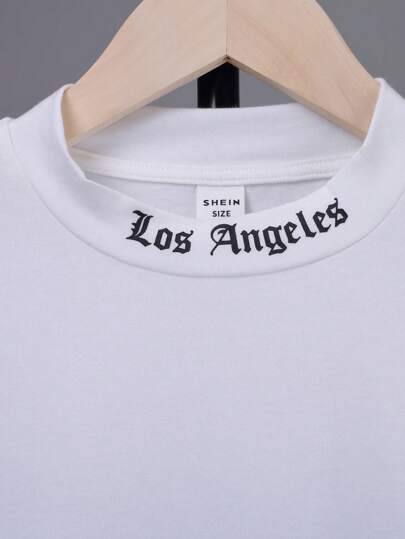 SHEIN تي شيرت تريكو ذو تصميم خط جوثيك كبير الحجم للفتى المراهق