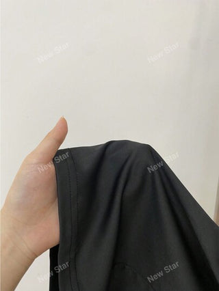 جمبسوت موحدة اللون ياقة غير متماثل حزام