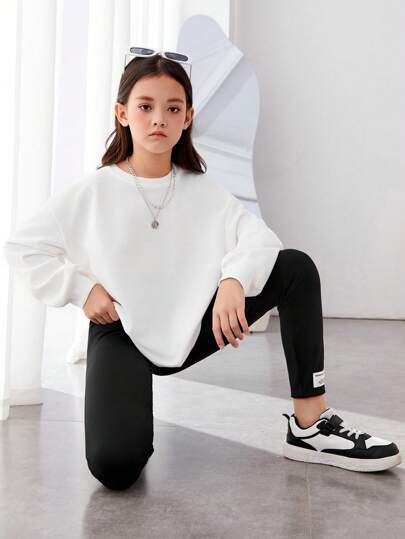 girls-sets بلوفر وبنطال ضيق بكتف منسدل وطبعة وجه كرتونية من Tween Girl