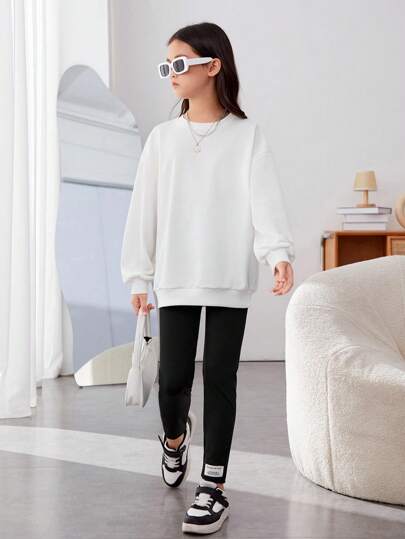 girls-sets بلوفر وبنطال ضيق بكتف منسدل وطبعة وجه كرتونية من Tween Girl