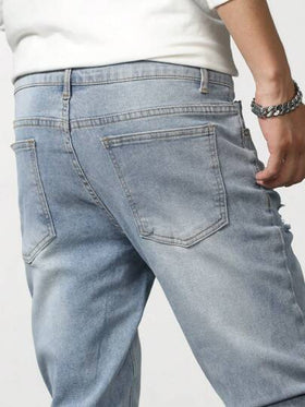 Manfinity Homme جينز رجالي بجيوب مائلة وتمزقات وقصة ضيقة وجيب شحن بلون أزرق فاتح، قطني، أساسي للعمل، يعمل كقطعة أساسية في خزانة زوجك