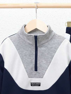 SHEIN بدلة تي شيرت وبنطلون شاب توأم متباينة الألوان ،مع تصميم ذو ياقة تقف بتفاصيل