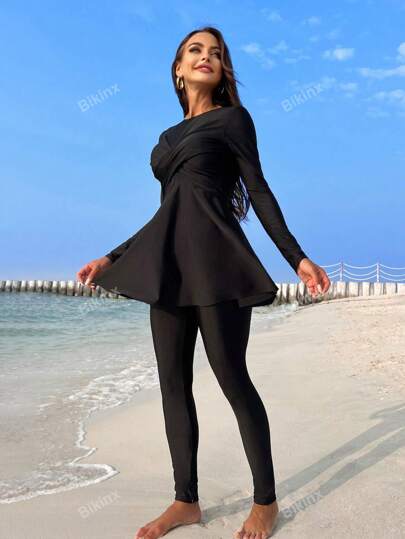 طقم تانكيني حريمي Bikinx ملابس سباحة تنكي مع ملابس علوية مطوي متقاطع و بنطلون قصير لموسم الصيف