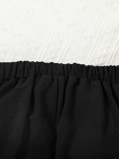 SHEIN بنطلون أسود للفتاة الشابة بتصميم جريء مع زخرفة سلسلة معدنية