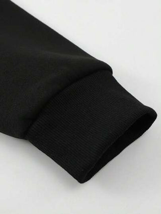 Manfinity Homme سويت شيرت رجالي برقبة دائرية فضفاض القياس وطبعة شعار