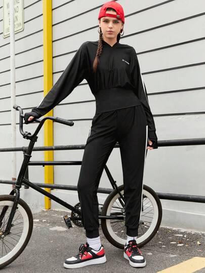 SHEIN Sports بدلة رياضية نسائية للجري بثقب إبهام وجانب متباين
