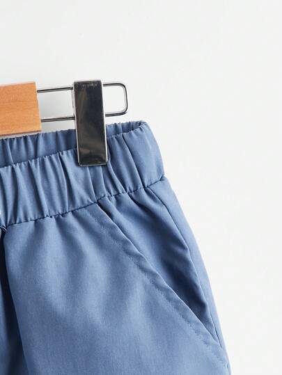 SHEIN بنطال صبيانى مستقيم الساق بخصر عالٍ أحادي اللون مع جيوب مائلة