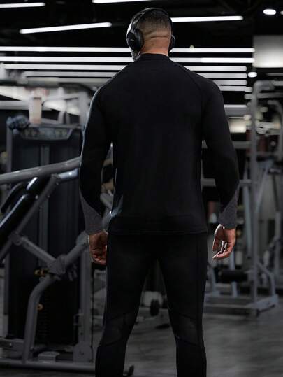 Manfinity Sport Corelite تي شيرت رياضي طويل الأكمام بأكمام ملونة وسحاب للرجال بطراز صديق