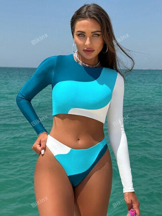 Bikinx بدلة سباحة فوقية مع تصميم ظهر مفتوح ملونة المقاطع والتصميم المتباين غير المتماثل، بأكمام طويلة للرياضة والأوقات الفراغية للصيف