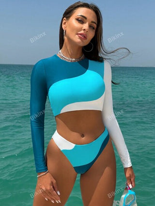 Bikinx بدلة سباحة فوقية مع تصميم ظهر مفتوح ملونة المقاطع والتصميم المتباين غير المتماثل، بأكمام طويلة للرياضة والأوقات الفراغية للصيف