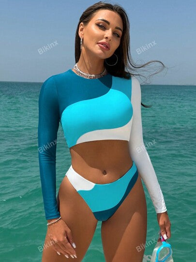 Bikinx بدلة سباحة فوقية مع تصميم ظهر مفتوح ملونة المقاطع والتصميم المتباين غير المتماثل، بأكمام طويلة للرياضة والأوقات الفراغية للصيف