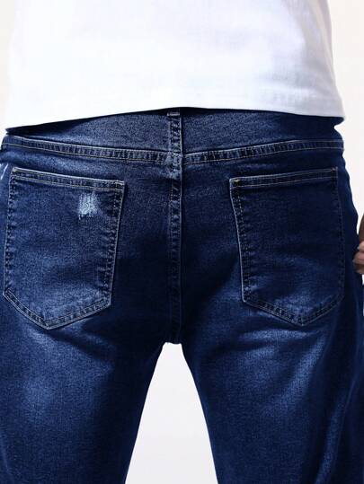 Manfinity Homme بنطلون قصير جينز بحافة ملفوفة ممزق الذيل للرجال
