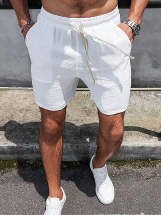 Manfinity Homme شورت رجالي بخصر مطاطي من الستان والكتان أحادي اللون، قصير وبسيط للاستجمام والعطلات باللون الأبيض، هدية مناسبة للزوج أو الحبيب