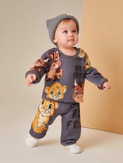 SHEIN Playful Pals طقم ملابس للأطفال الصغار, غير متماثل, مطبوع برسومات الأسد والوحيد القرن, متميز بتصاميم مبهجة للأسد والوحيد القرن على قماش ناعم ومريح, للارتداء الفريد والمرح