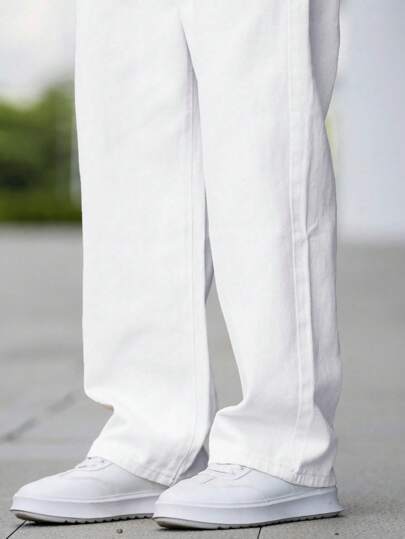 Manfinity Homme سروال جينز طويل بتقطيعة مستقيمة وبلون سادة بسيط للرجال