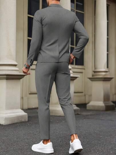 Manfinity Bizformal بدلة رجالية قطعتين تتكون من ملابس علوية بأكمام طويلة من لون واحد ذو ياقة مسطحة وأزرار أمامية، وبنطلون طويل، تصميم بسيط