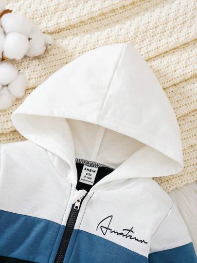 SHEIN مجموعة ملابس ولادية من طقم ملابس علوية ذات سحاب مطبوع بخطوط ملونة مع غطاء رأس وبنطلون خصر مطاطي للشارع بمظهر عصري 2 قطعة