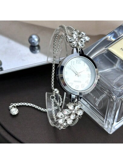 ساعة كوارتز للنساء بعقارب مرصعة بالراين ستون الملون كبتلات زهر، بسوار قابل للسحب، عقارب باللغة العربية، تصميم أنيق للسيدات